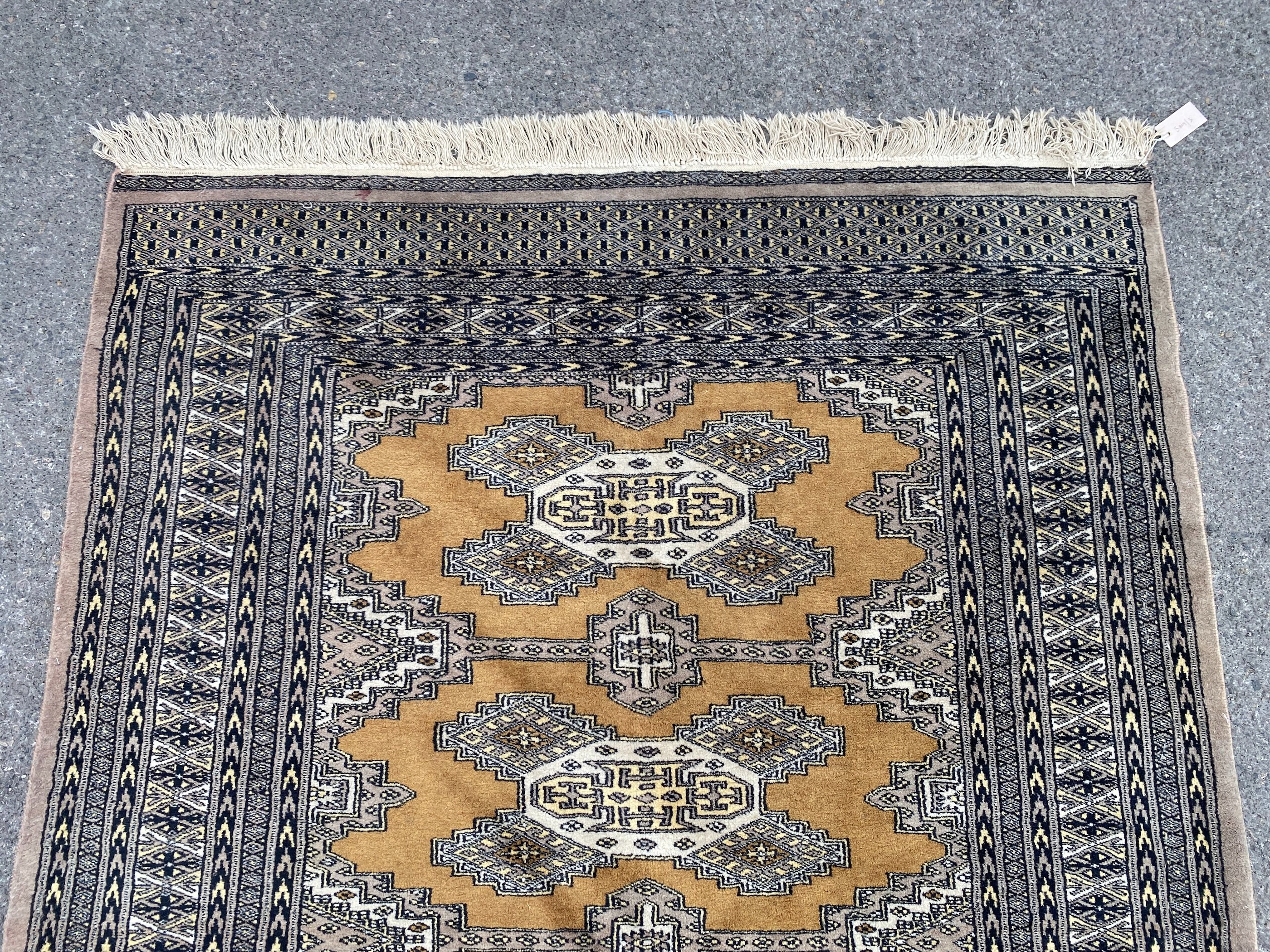 A Bokhara gold ground rug, 190 x 136cm
